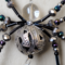 detailed 4" black and silver gray beaded spider 10mm clear glass head, 20mm silver plated body,  movable legs, glass seed beads, flat pose